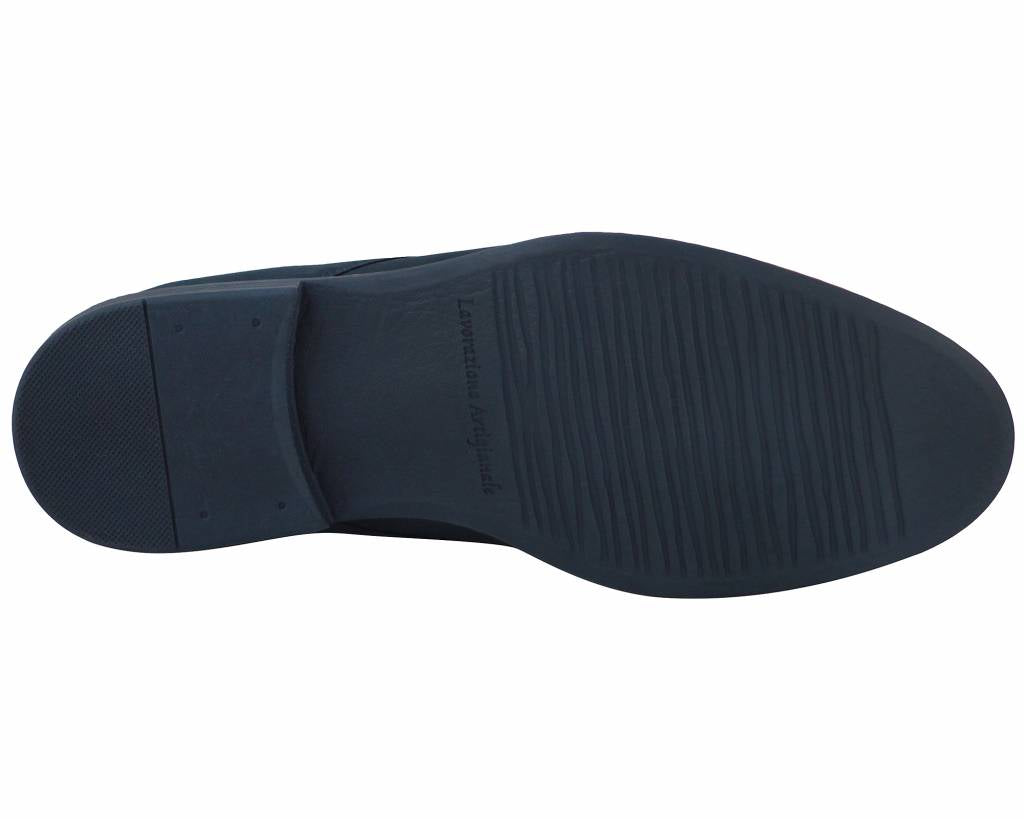 Underside of the navy derby shoe showing the ridged tread panels
