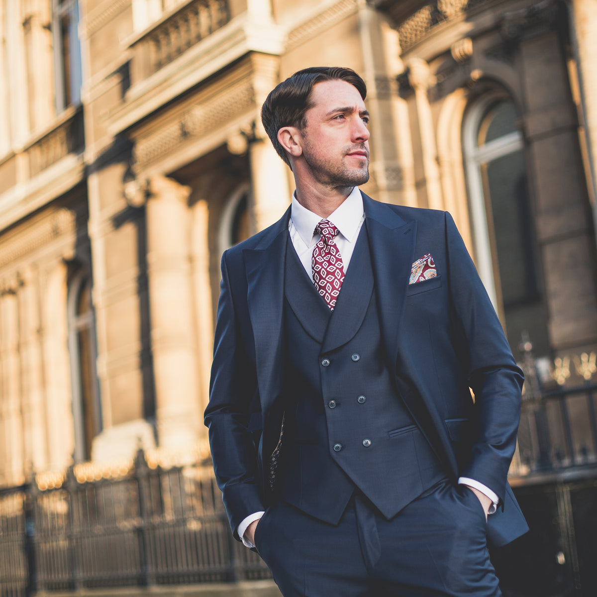 man wearing wide peak lapel navy suit from John Victor Tailoring