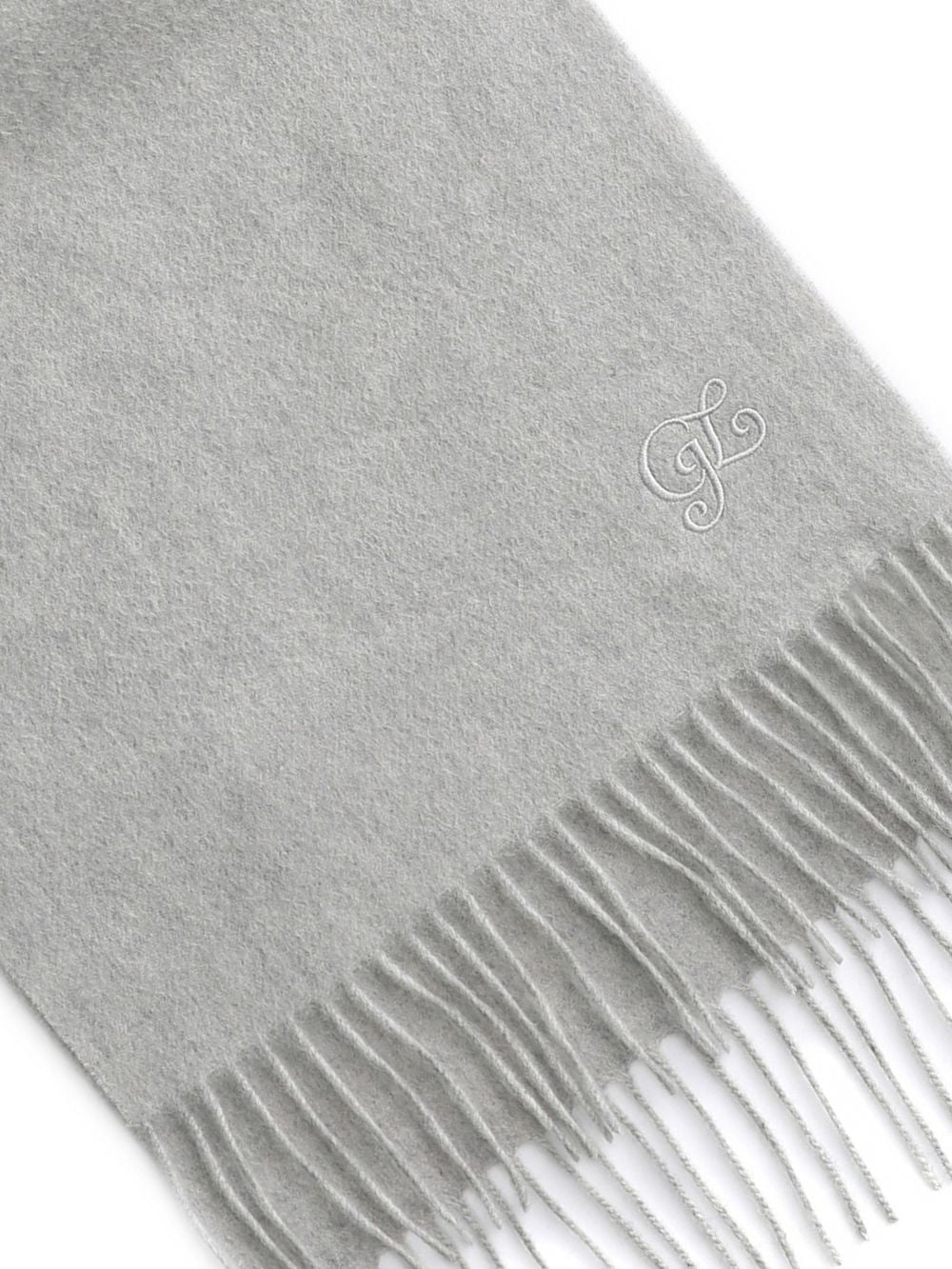 Close-up of the fringe and tonal embroidery on the Grey cashmere wool scarf