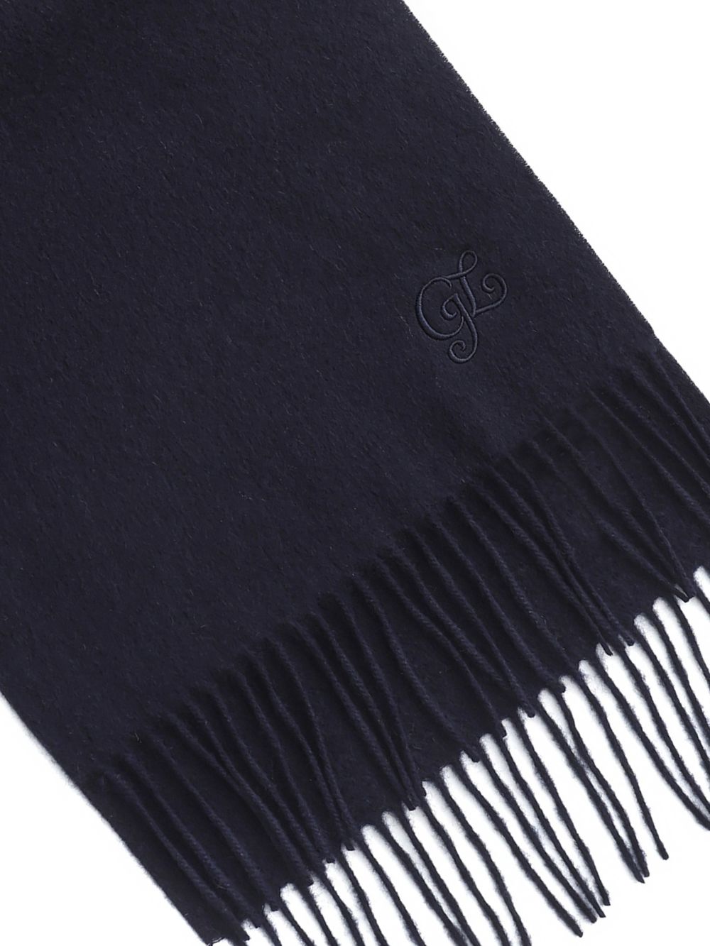 Close-up of the fringed end and embroidery on the Navy cashmere wool scarf