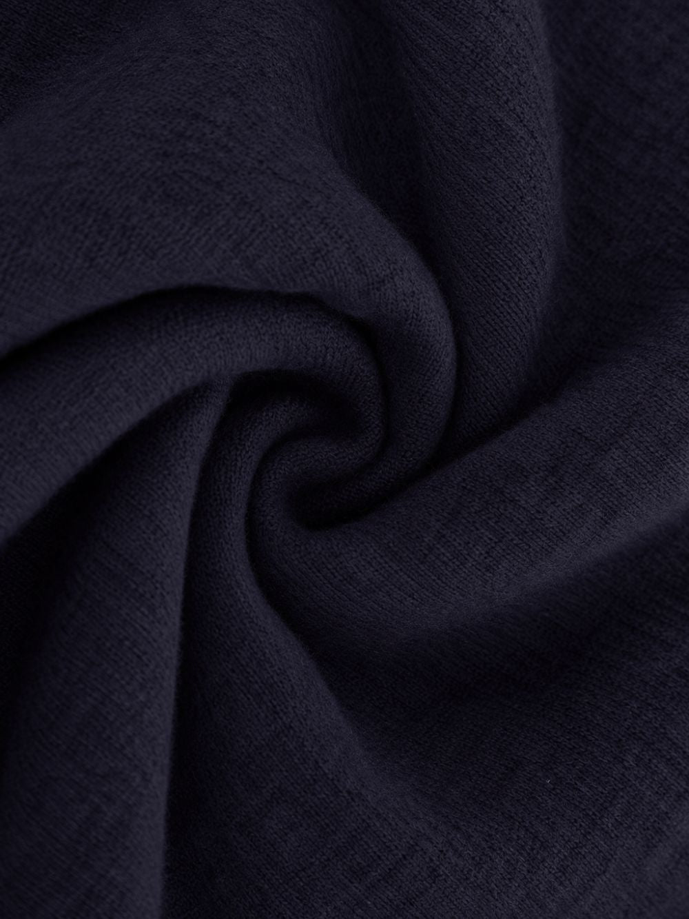 Navy cashmere wool scarf swirled to show the texture of the cloth