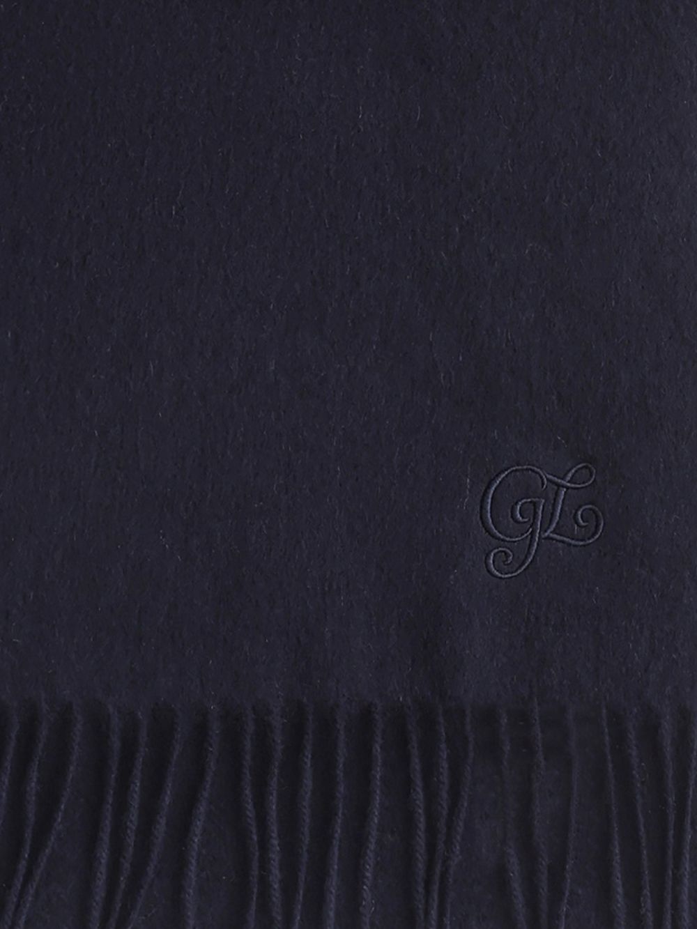 Detail of the tonal corner embroidery above the fringe on the Navy scarf