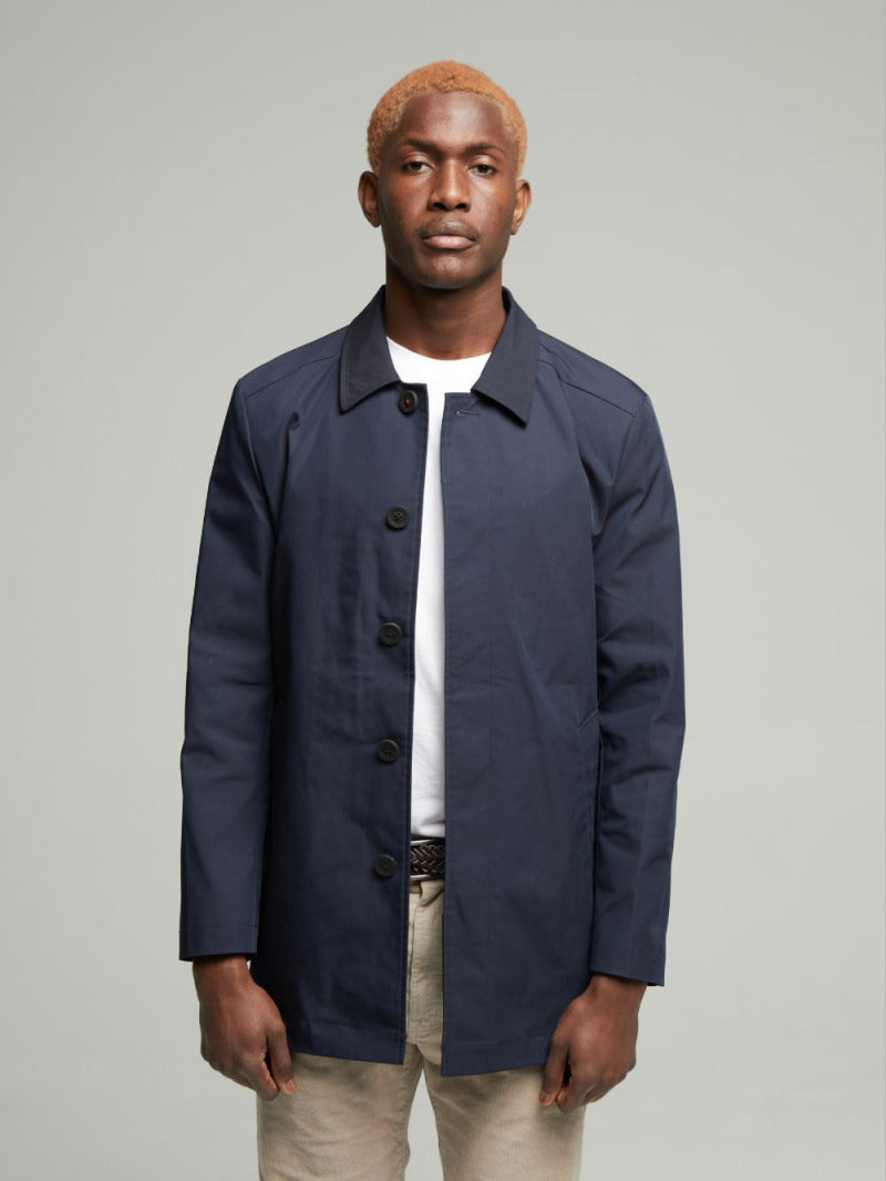 Navy Wentworth raincoat worn with stone chinos, front view with collar down