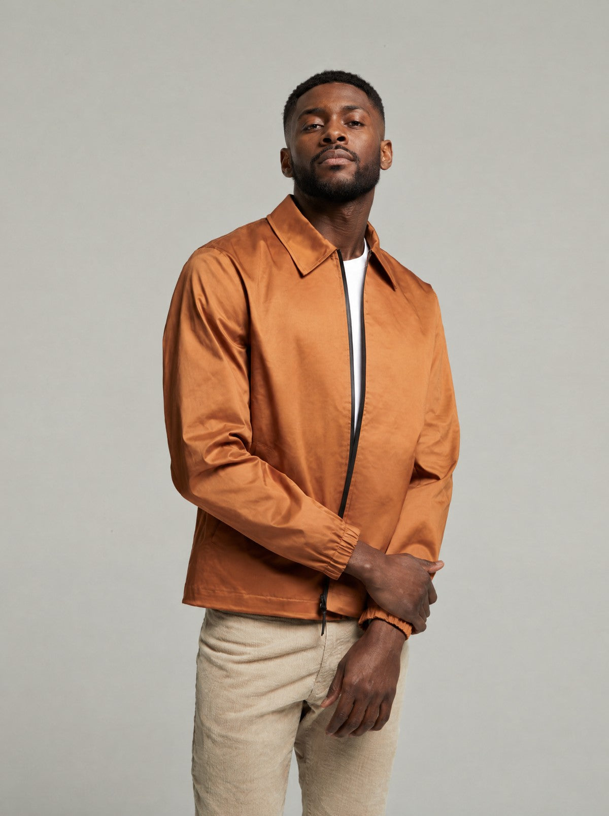 Martelloz coach jacket in Tan worn with the collar down, front view