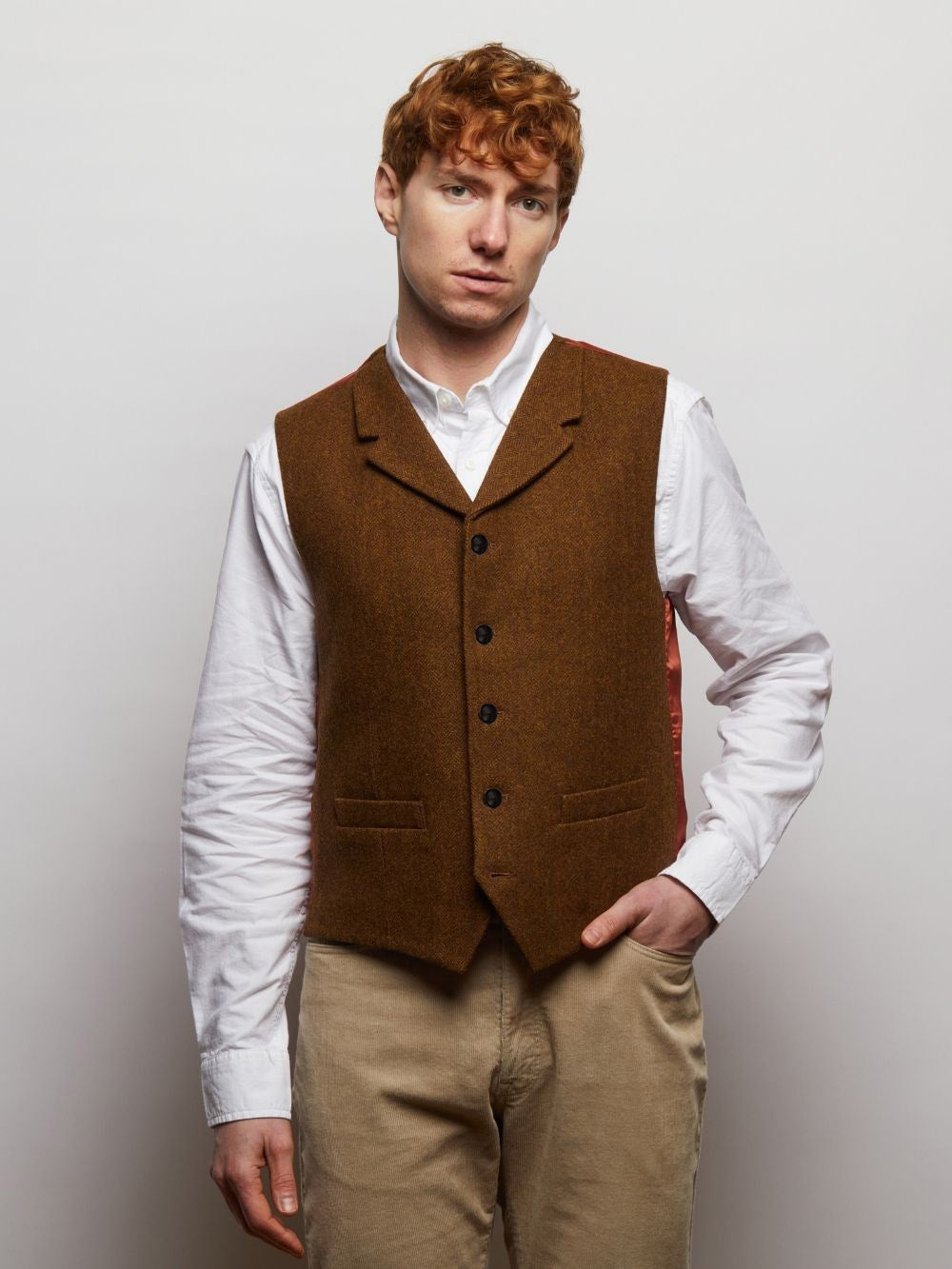 Sherwood tweed waistcoat in Brown Herringbone, worn over a white shirt