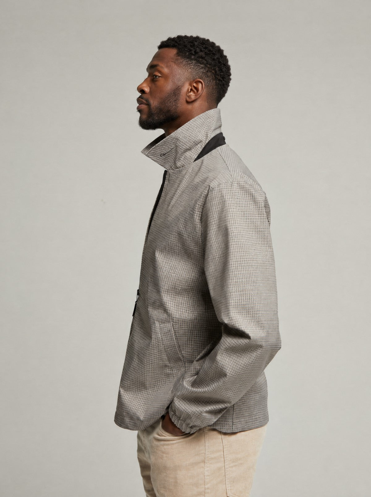 Side profile of the Check Martelloz coach jacket with the collar turned up