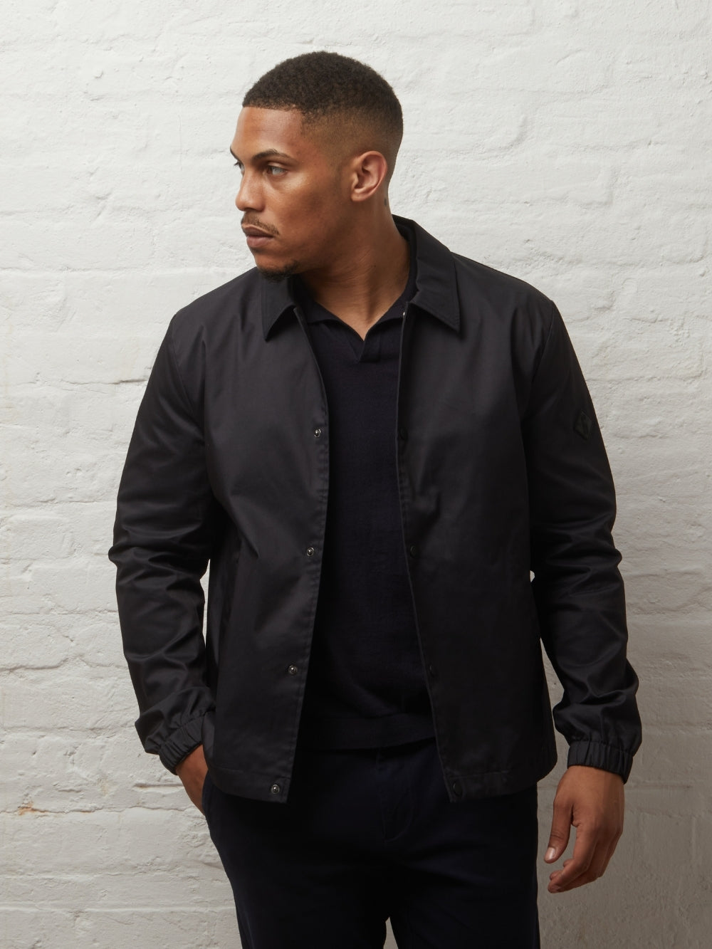 Guards London Martello II Harrington jacket in Black, worn open on a model, three-quarter view
