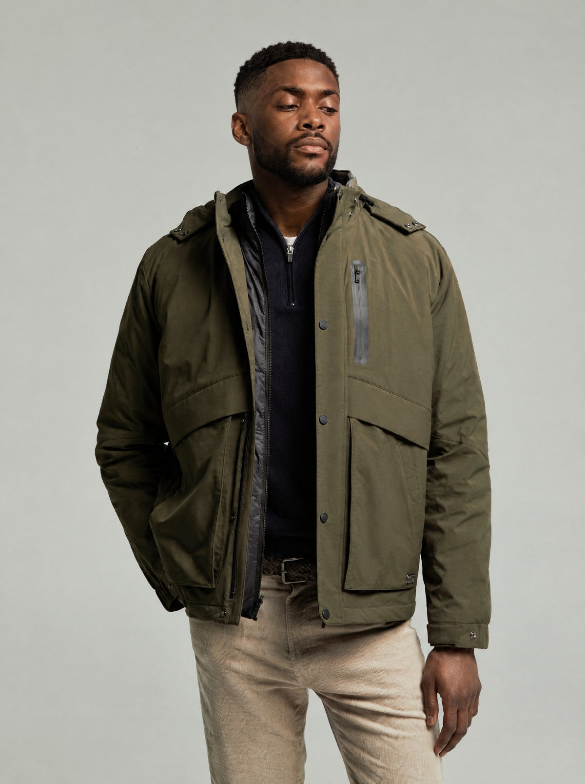 Leighton padded parka in Green worn open over the inner gilet, front view