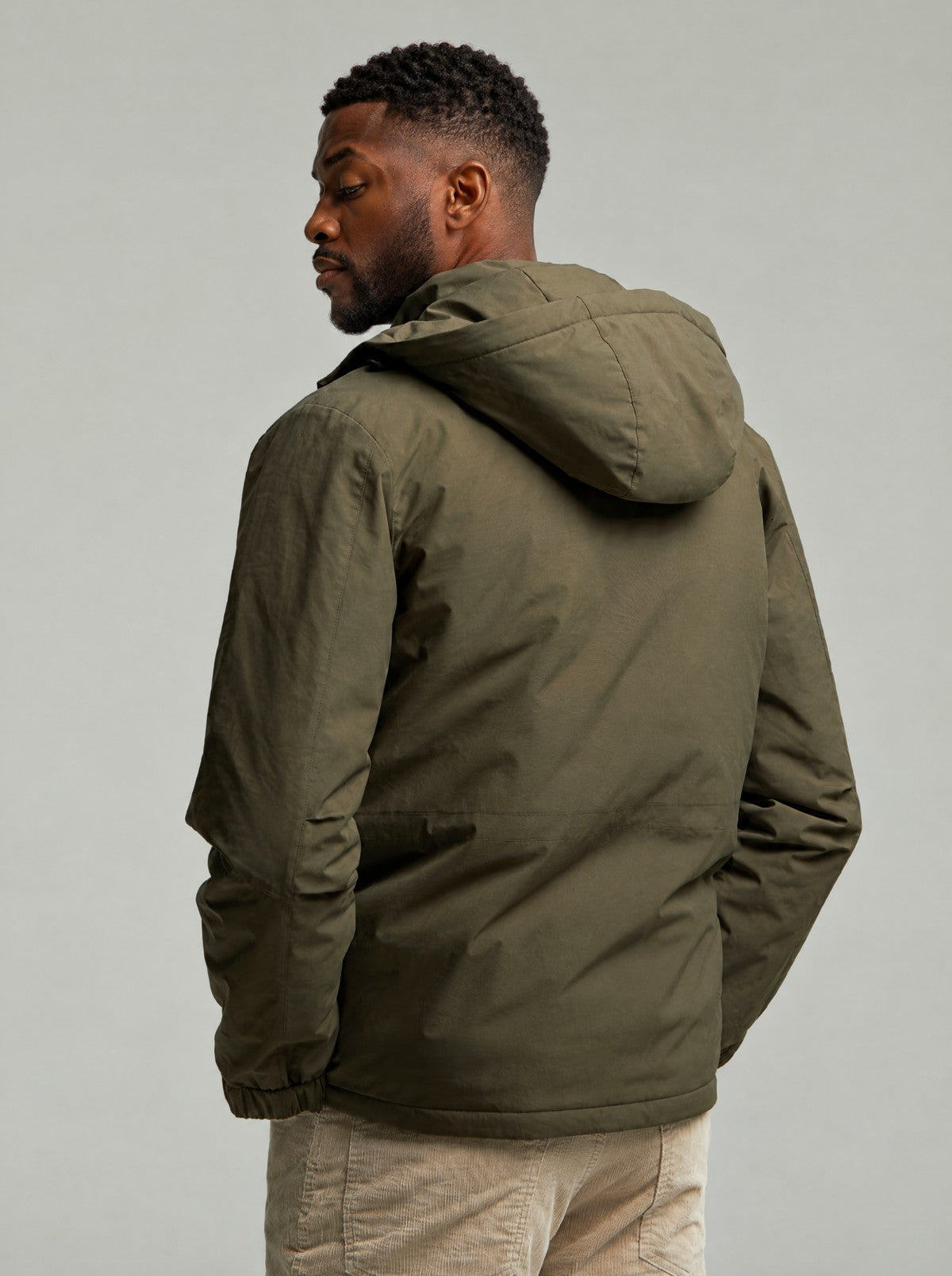 Back view of the Green Leighton parka with the hood up