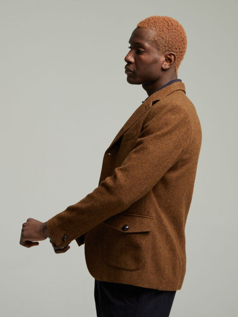 Side view of the Allenby wool tweed blazer in Brown worn on a model
