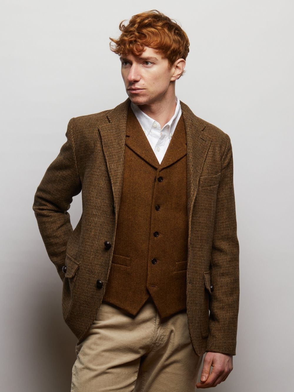 Brown Herringbone Sherwood waistcoat worn under a tweed jacket