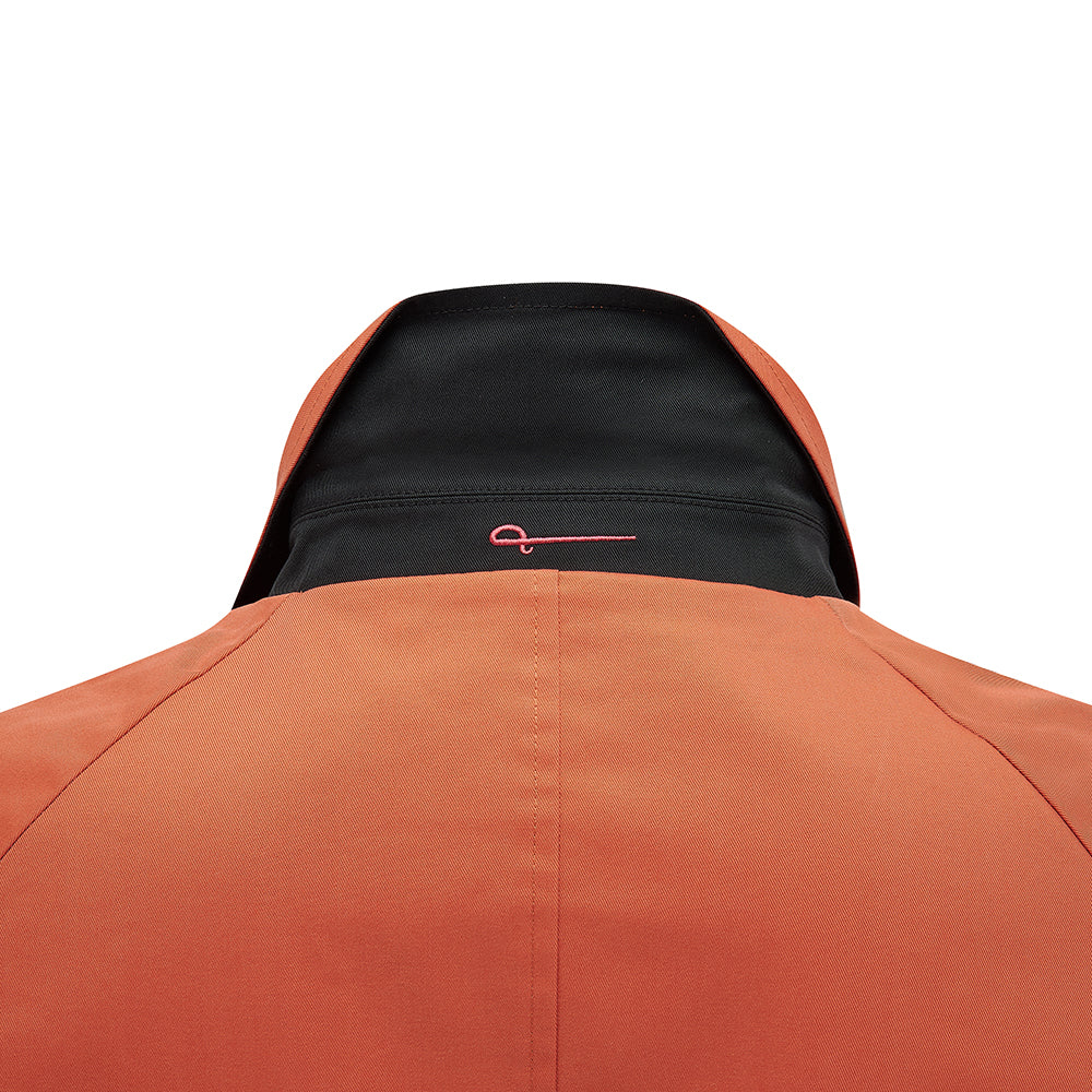 Close-up of the Fusilier Reversible Jacket collar, orange side with black undercollar