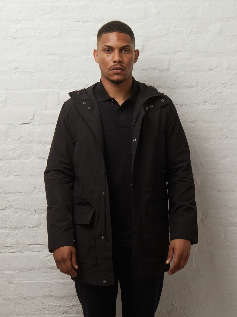 Blake lightweight parka in Black worn open on a model, front view