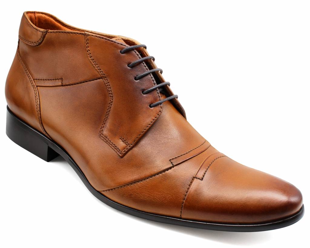 Front three-quarter view of the brown ankle boot with dark brown laces and stitched panels