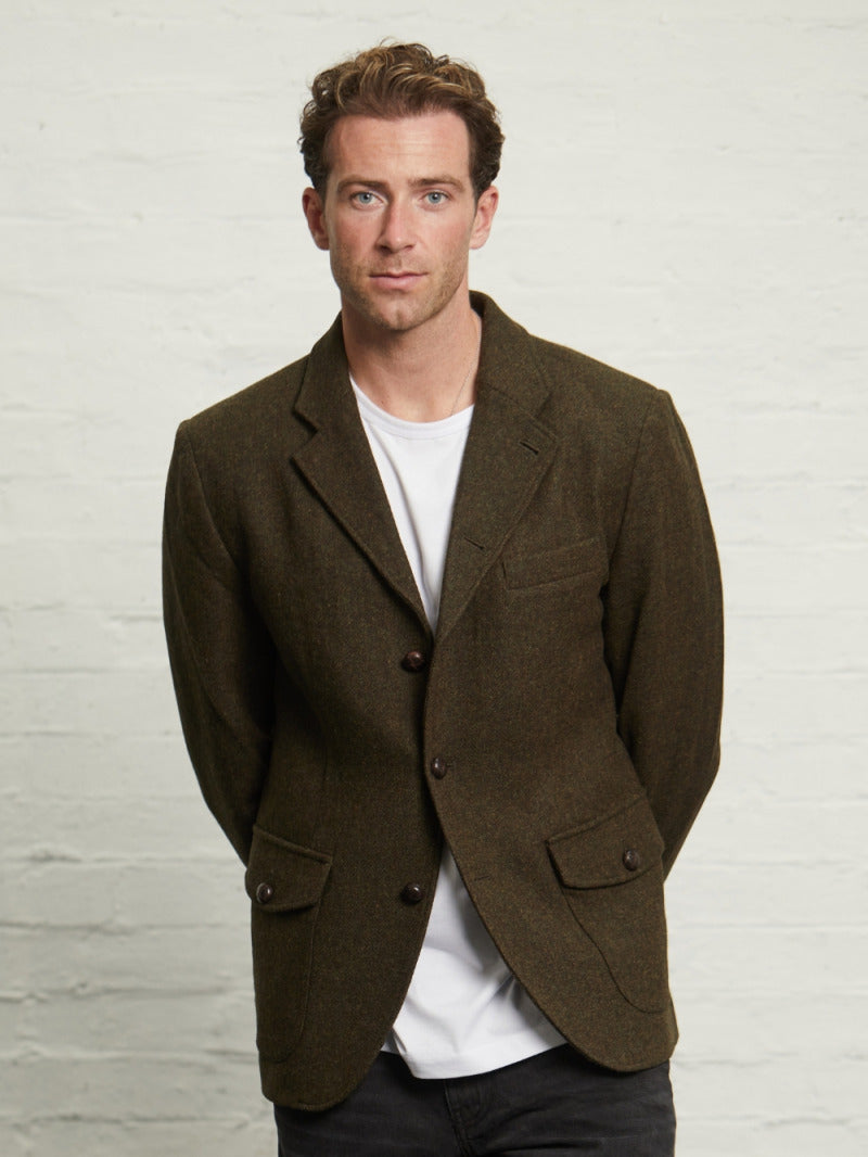 Allenby wool tweed blazer in Green worn open on a model over a white T-shirt