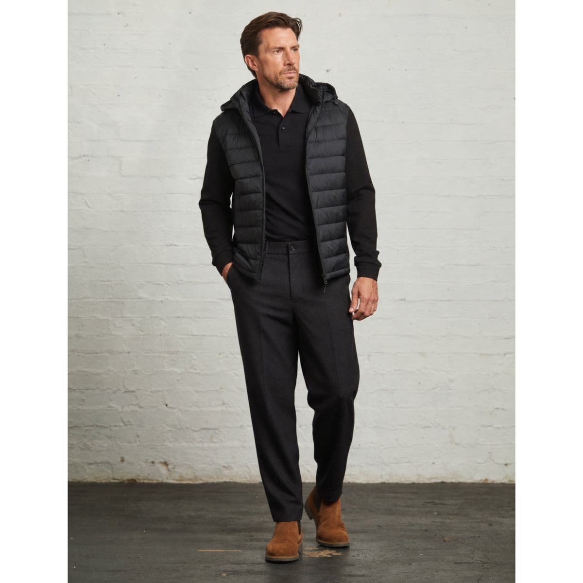 Bale hybrid jacket in Black, full-length view on a model with black trousers
