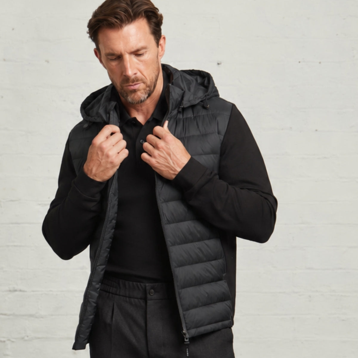 Bale quilted jacket in Black worn open on a model, showing the zip front