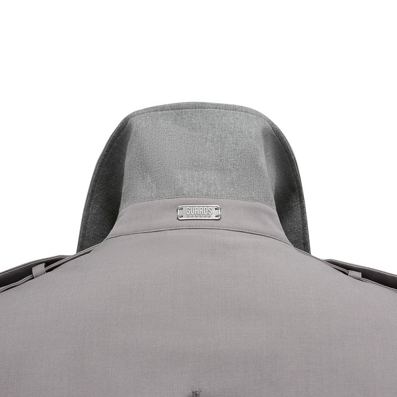 Close-up of the grey undercollar and metal badge on the Beacon trench coat in Putty