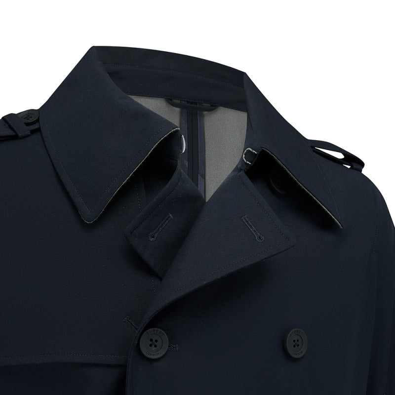 Close-up of the collar, storm flap and buttons on the Beacon trench coat in Navy