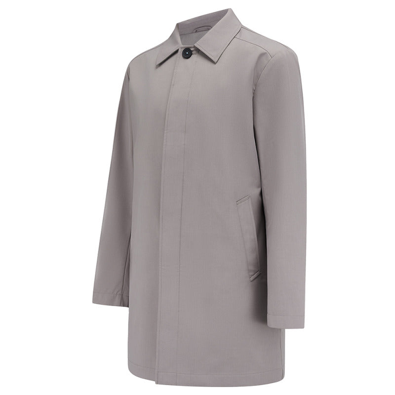 Carver raincoat in Putty, front flat lay with concealed button placket