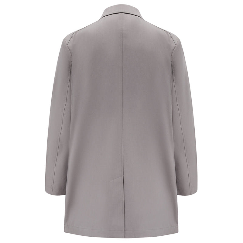 Back of the Carver raincoat in Putty, flat lay showing the back vent