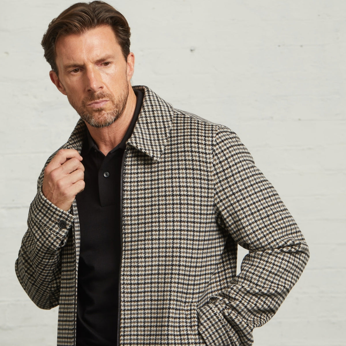 Close-up of the Edward check Harrington in Grey on a model, point collar visible