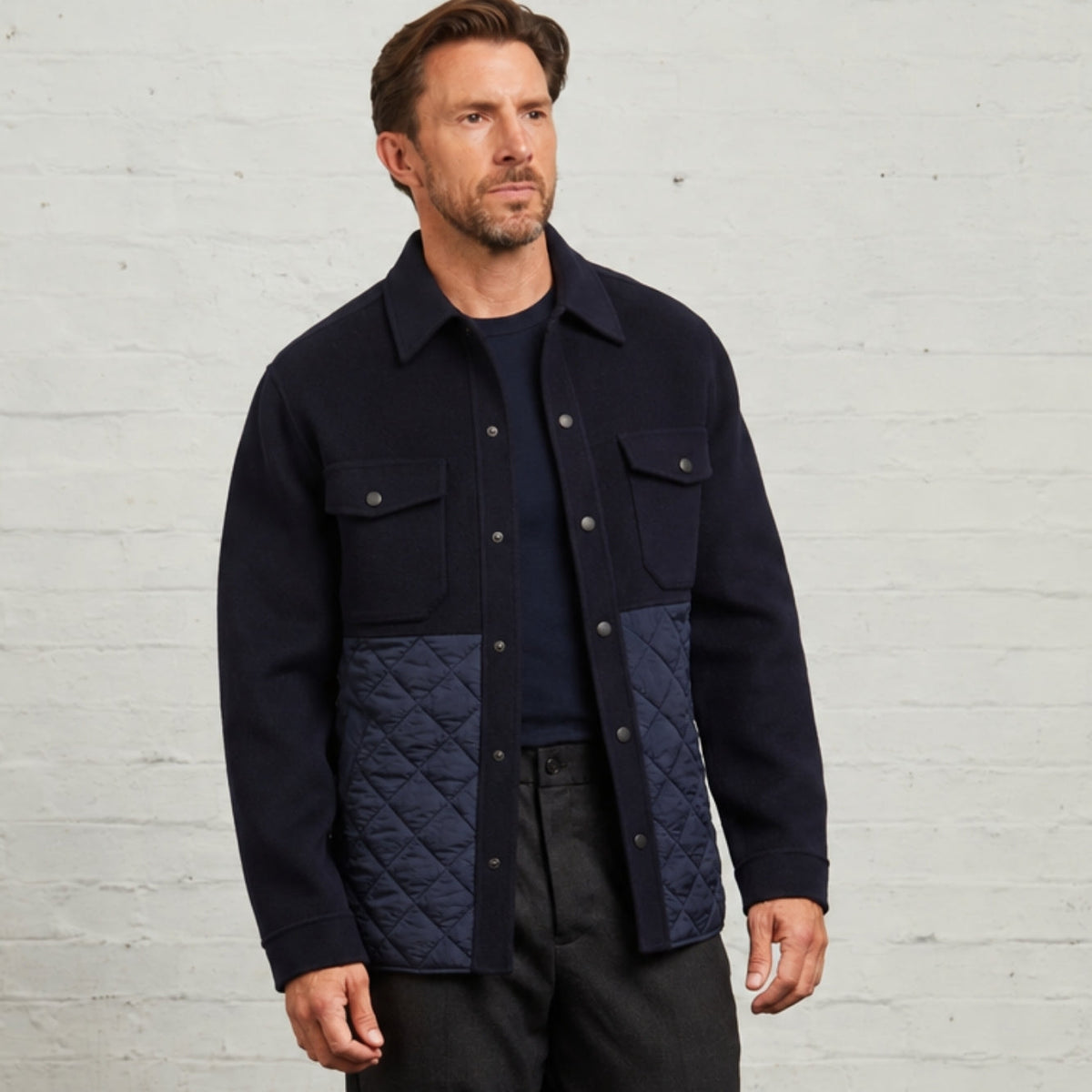 Horace Quilted Overshirt in Navy worn open over a T-shirt, front view
