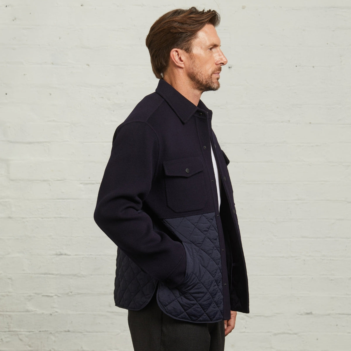 Horace Quilted Overshirt in Navy, side view showing the quilted side pocket