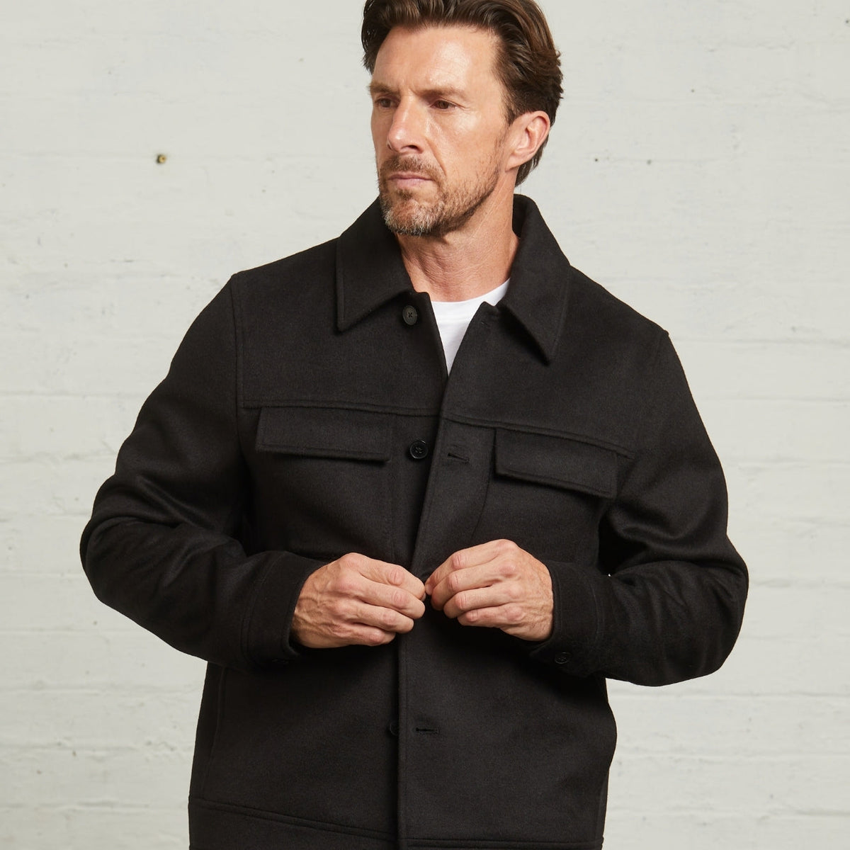 James Wool Short Jacket in Black, close front view being buttoned