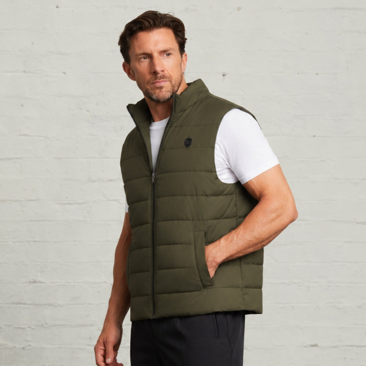 Khaki Monti quilted gilet worn on its own with a white T-shirt