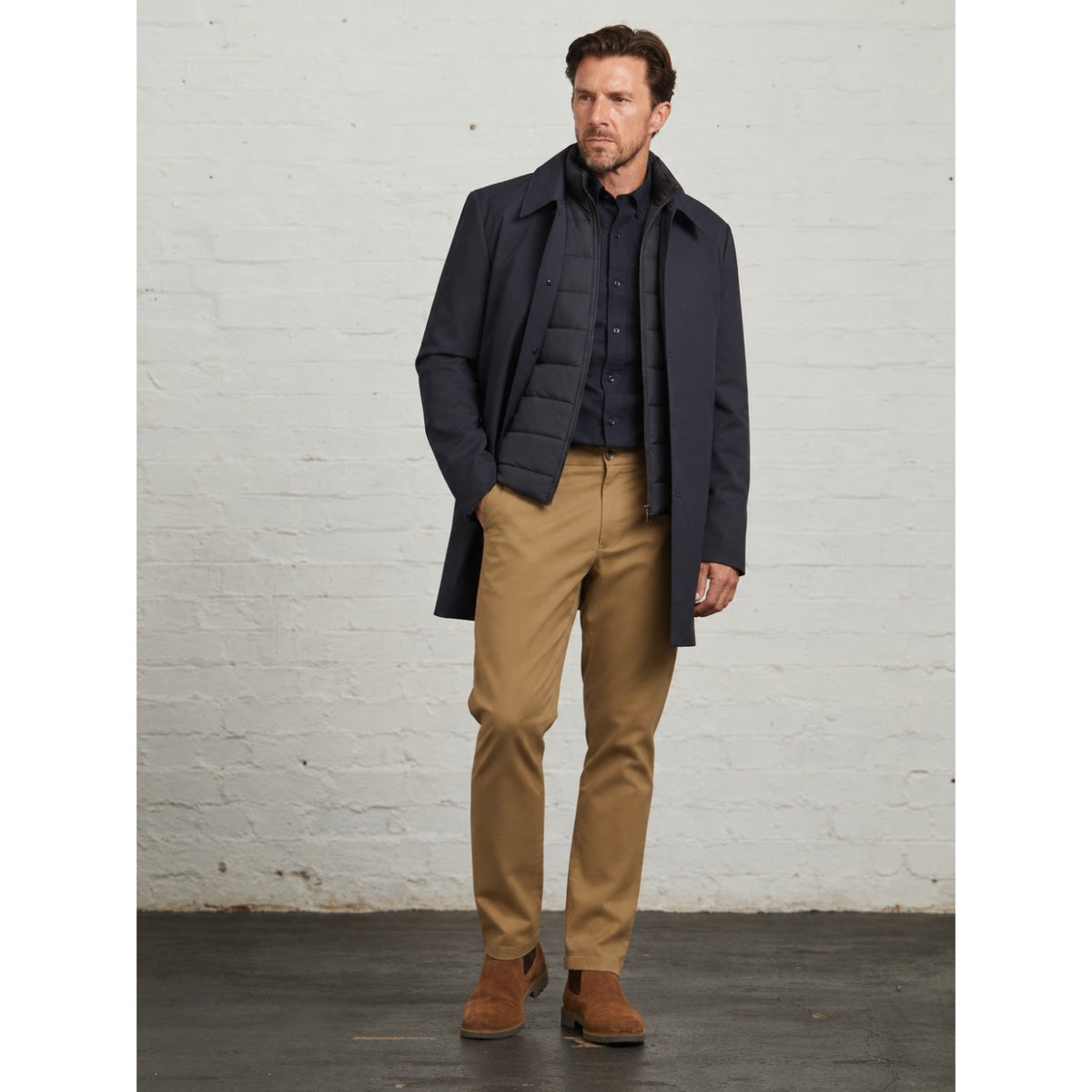 Monti raincoat in Navy, full-length view with tan chinos