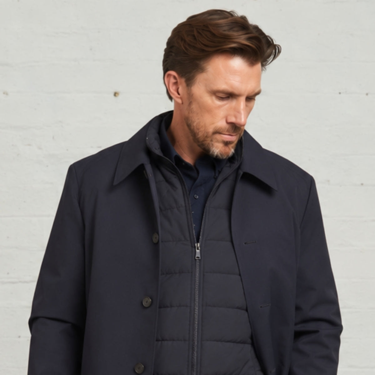 Close-up of the Navy Monti raincoat collar with the zipped gilet underneath
