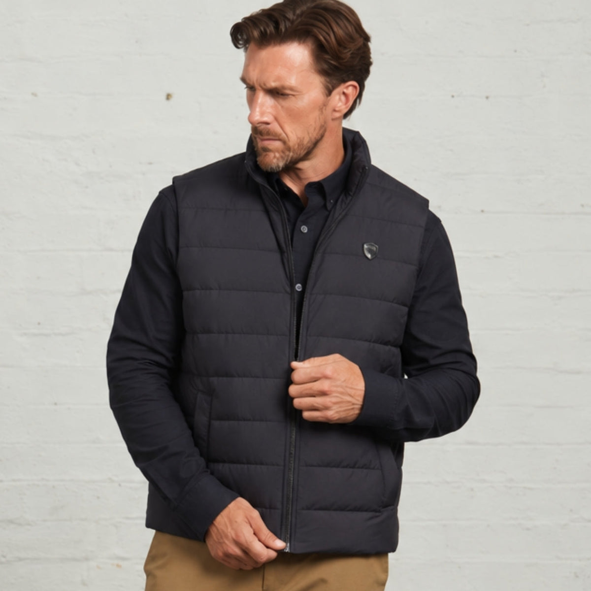 Navy Monti quilted gilet worn on its own over a navy shirt