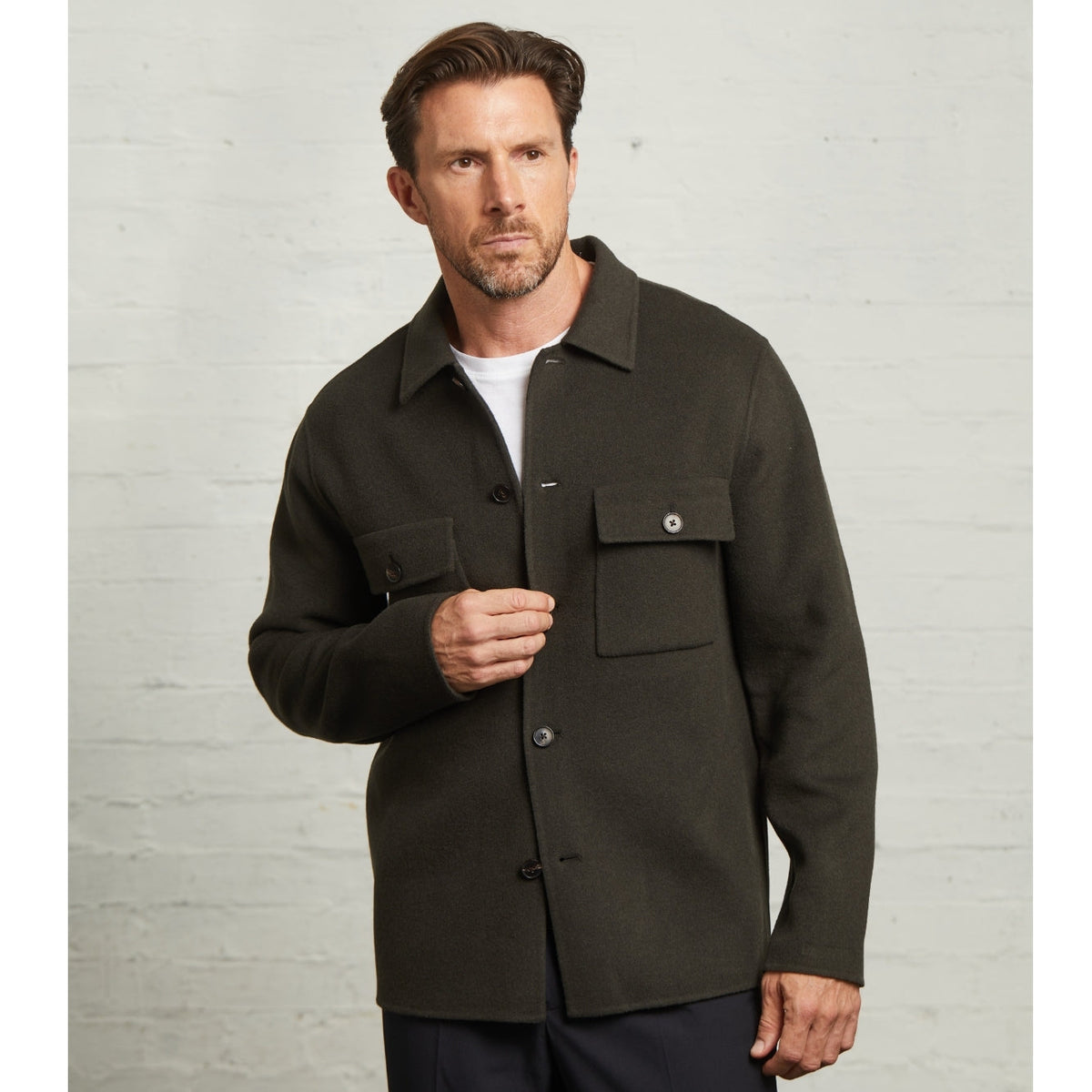 Oliver wool overshirt in Dark Green worn over a white T-shirt