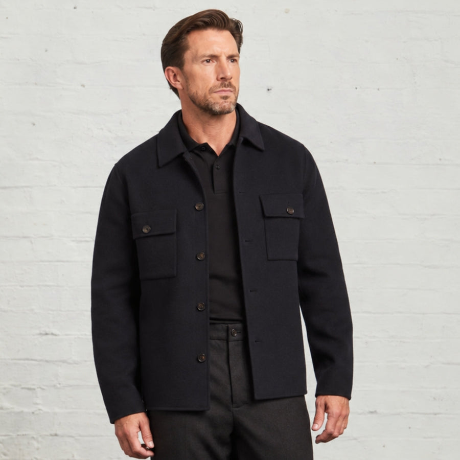 Guards London Oliver blind-seam overshirt in Navy, worn buttoned over a black polo