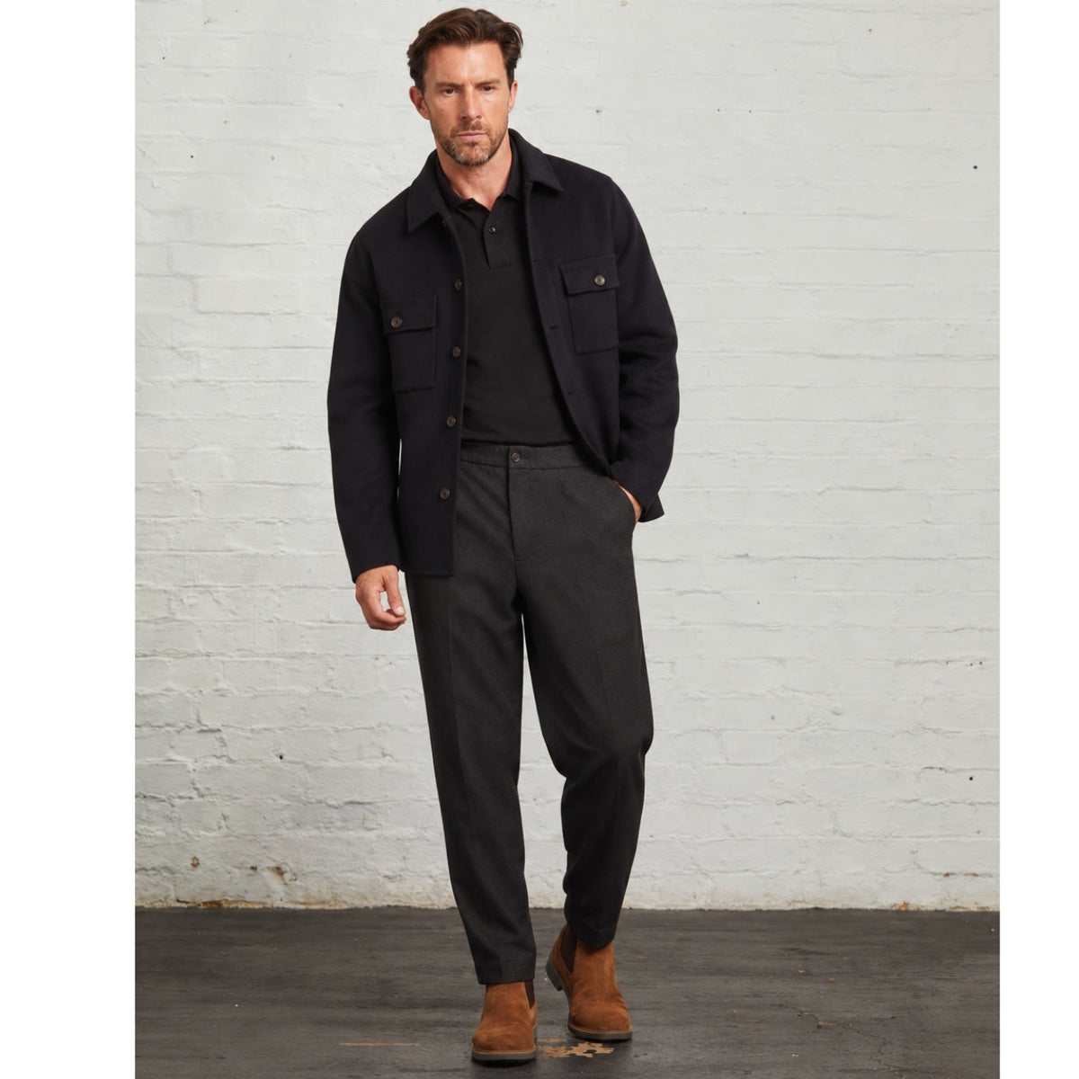 Oliver wool overshirt in Navy, full-length view with grey trousers