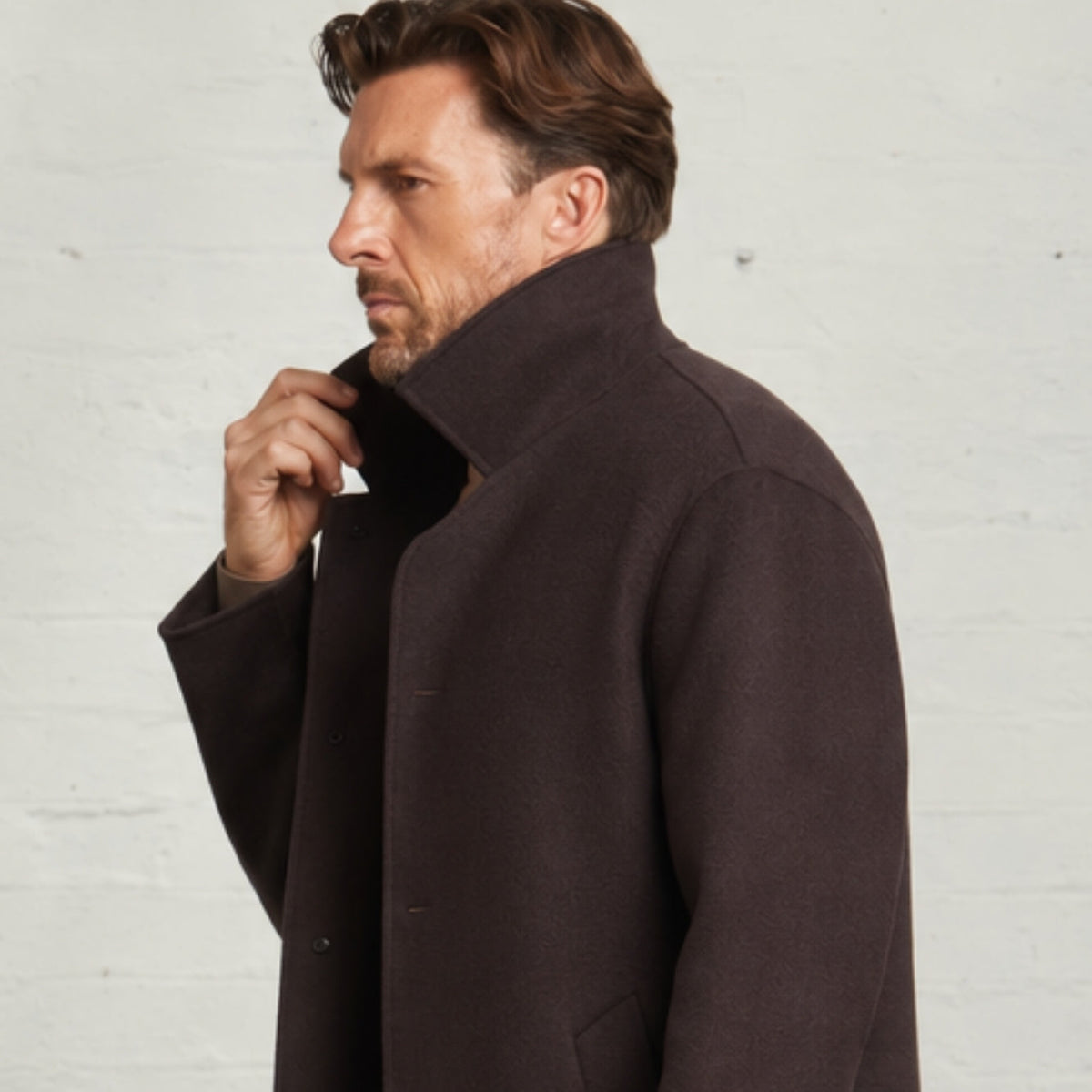 Close-up side view of the turned-up collar on the Chocolate Oscar overcoat
