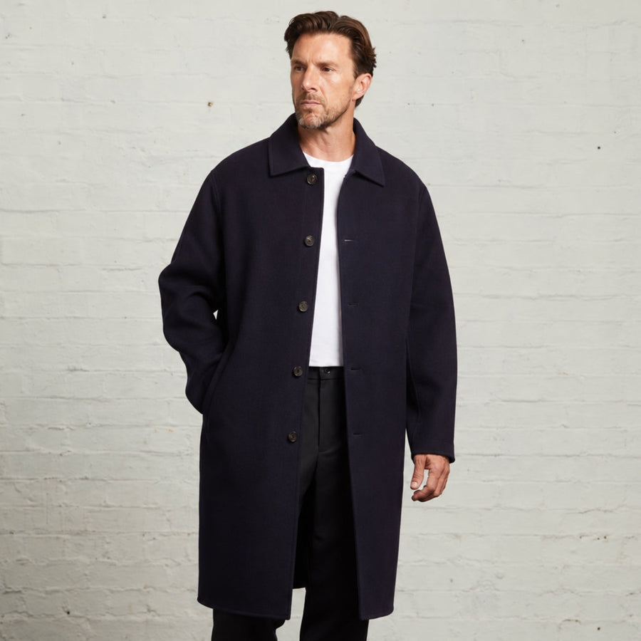 Guards London Oscar wool overcoat in Navy, worn open over a white T-shirt