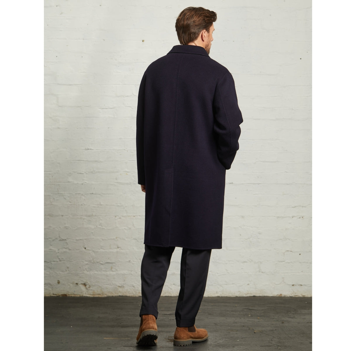 Back view of the Navy Oscar wool overcoat on a model