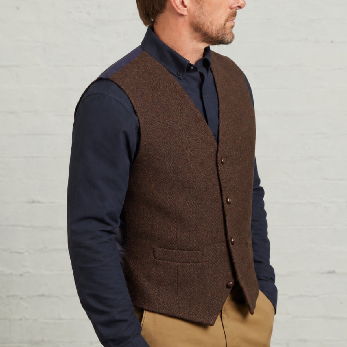 Close-up of the Brown Robert herringbone waistcoat and welt pockets
