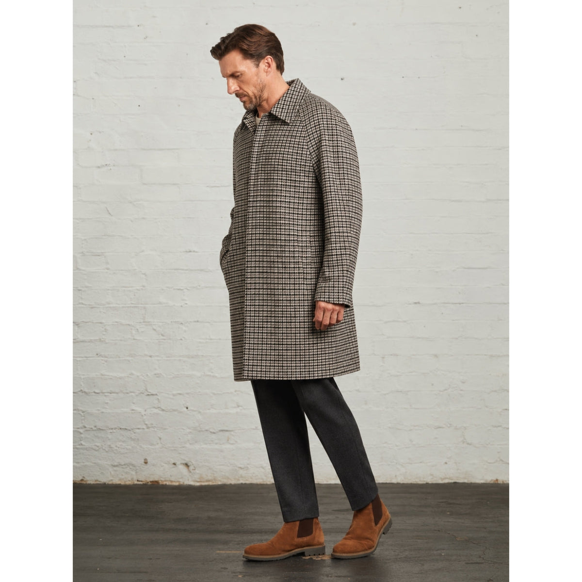 Side view of the Grey Walter Check Overcoat worn on a model, showing the raglan sleeve