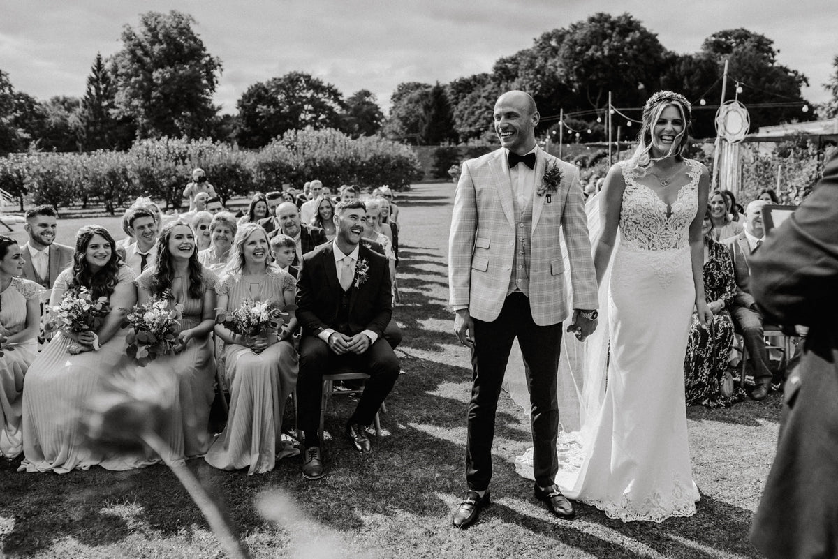 Outdoor wedding couple — made to measure wedding suits at Leonard Silver