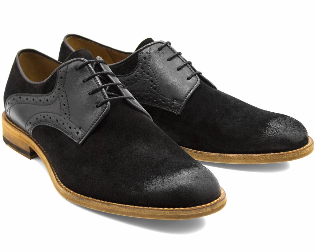 Pair of black suede derby shoes with brogued leather quarters, front three-quarter view