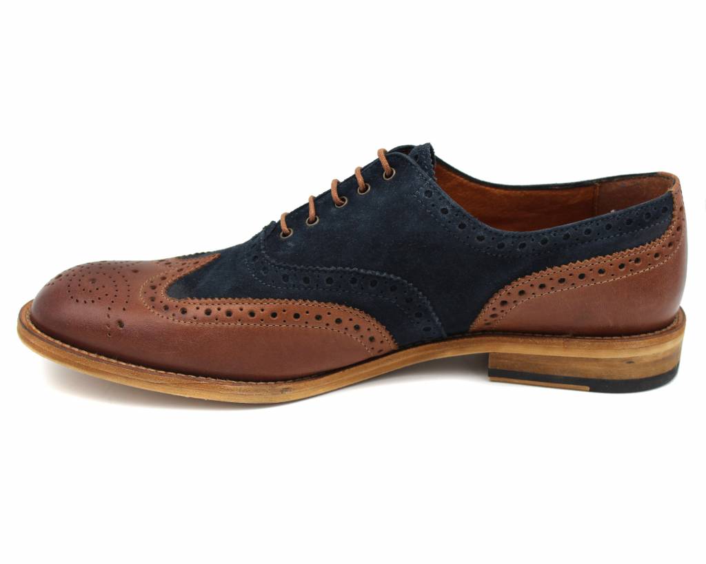 Side profile of the brown and navy brogue with toe facing left