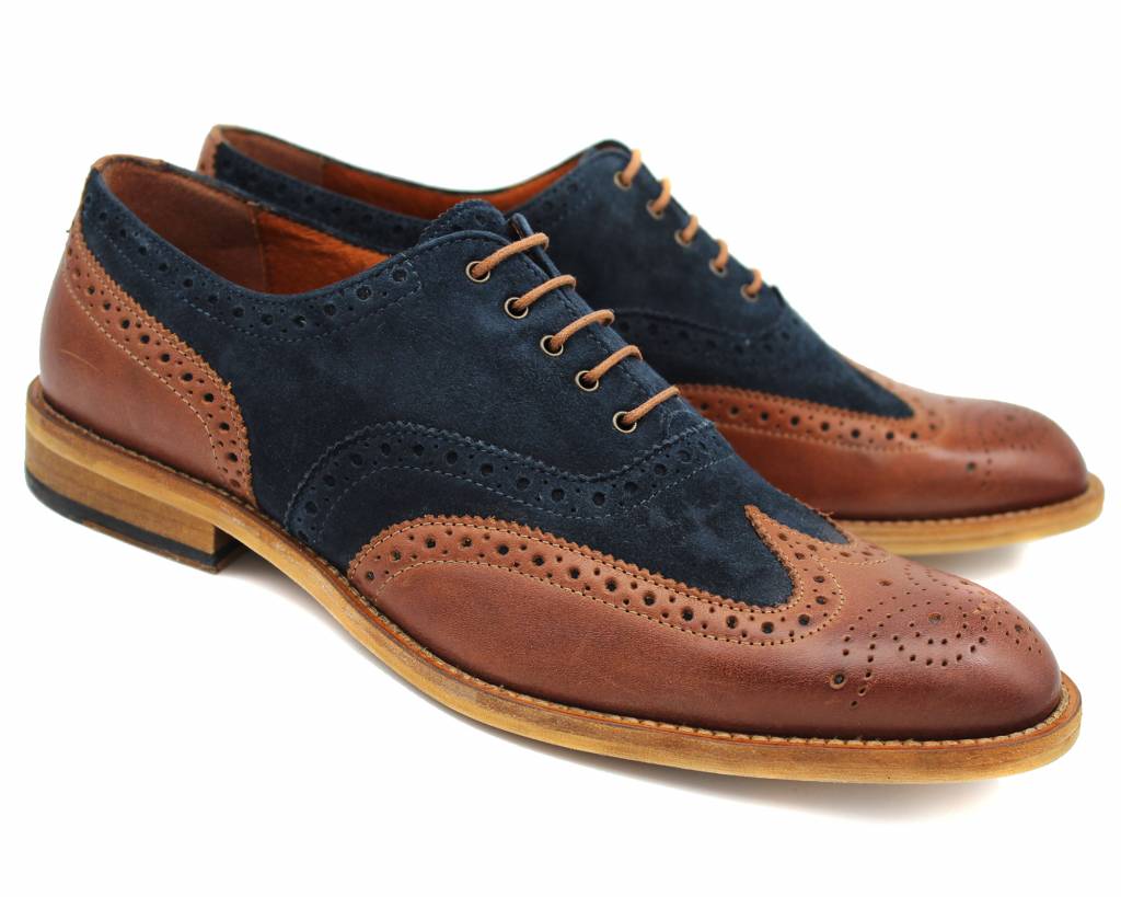 Pair of brown and navy suede brogues, front three-quarter view showing the toe medallion