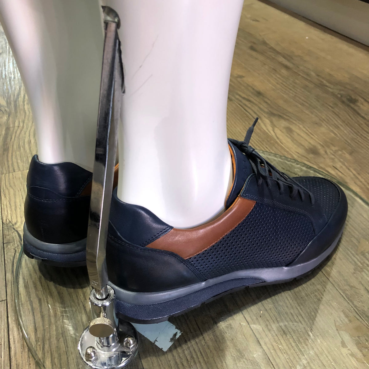 Perforated Navy Leather Trainer