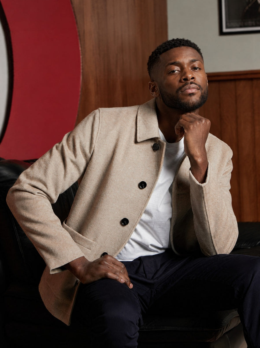 Guards London Westgate Wool Overshirt in Oatmeal, worn by a seated model over a white T-shirt